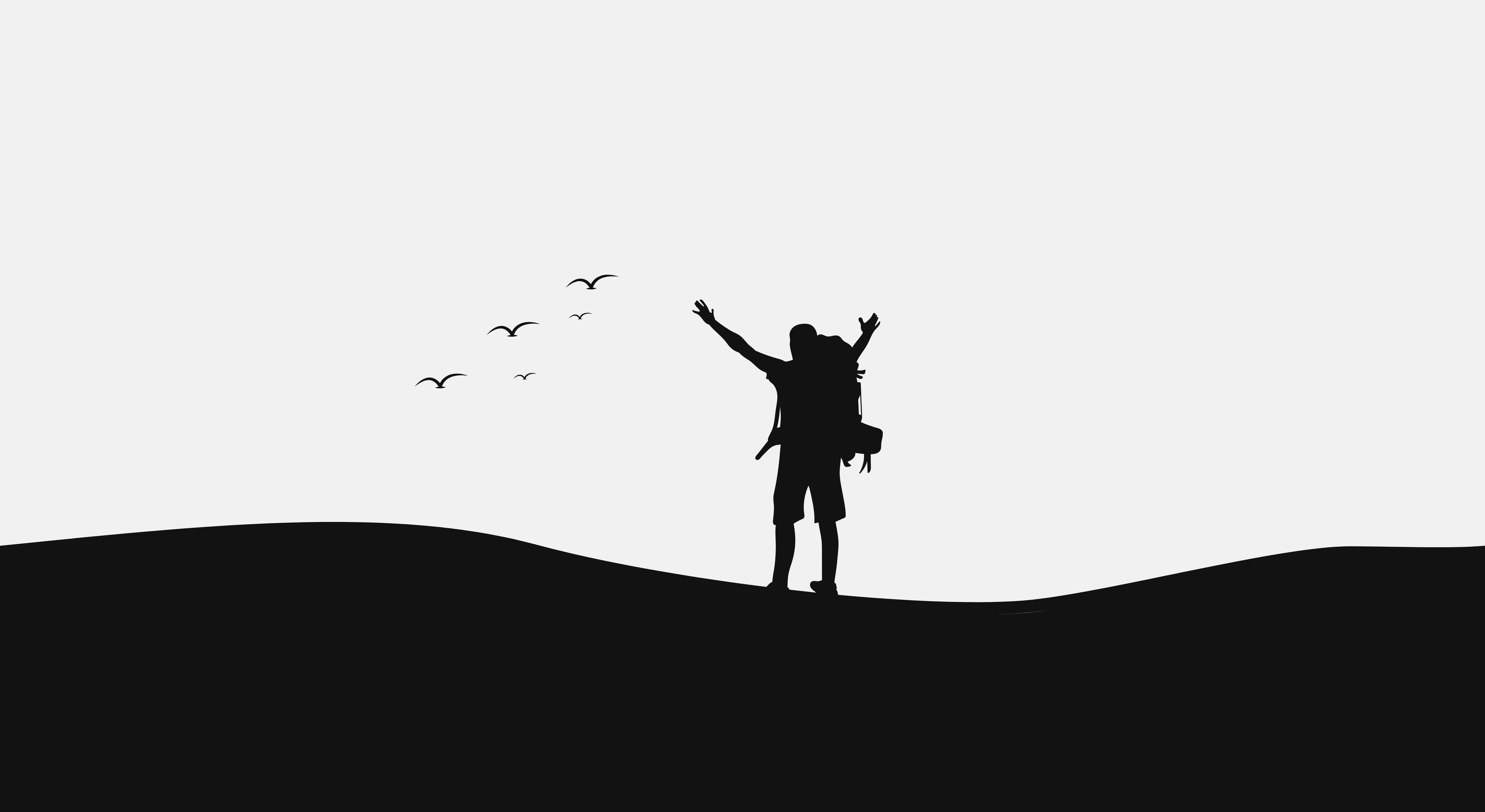 Man with backpack looking at birds